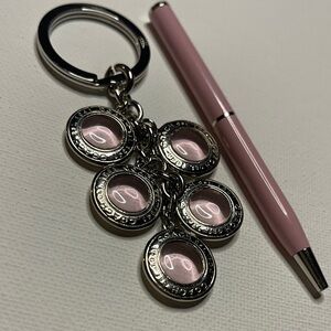 Coach Pink Keychain with Silver Accents and a Pink Coach Pen